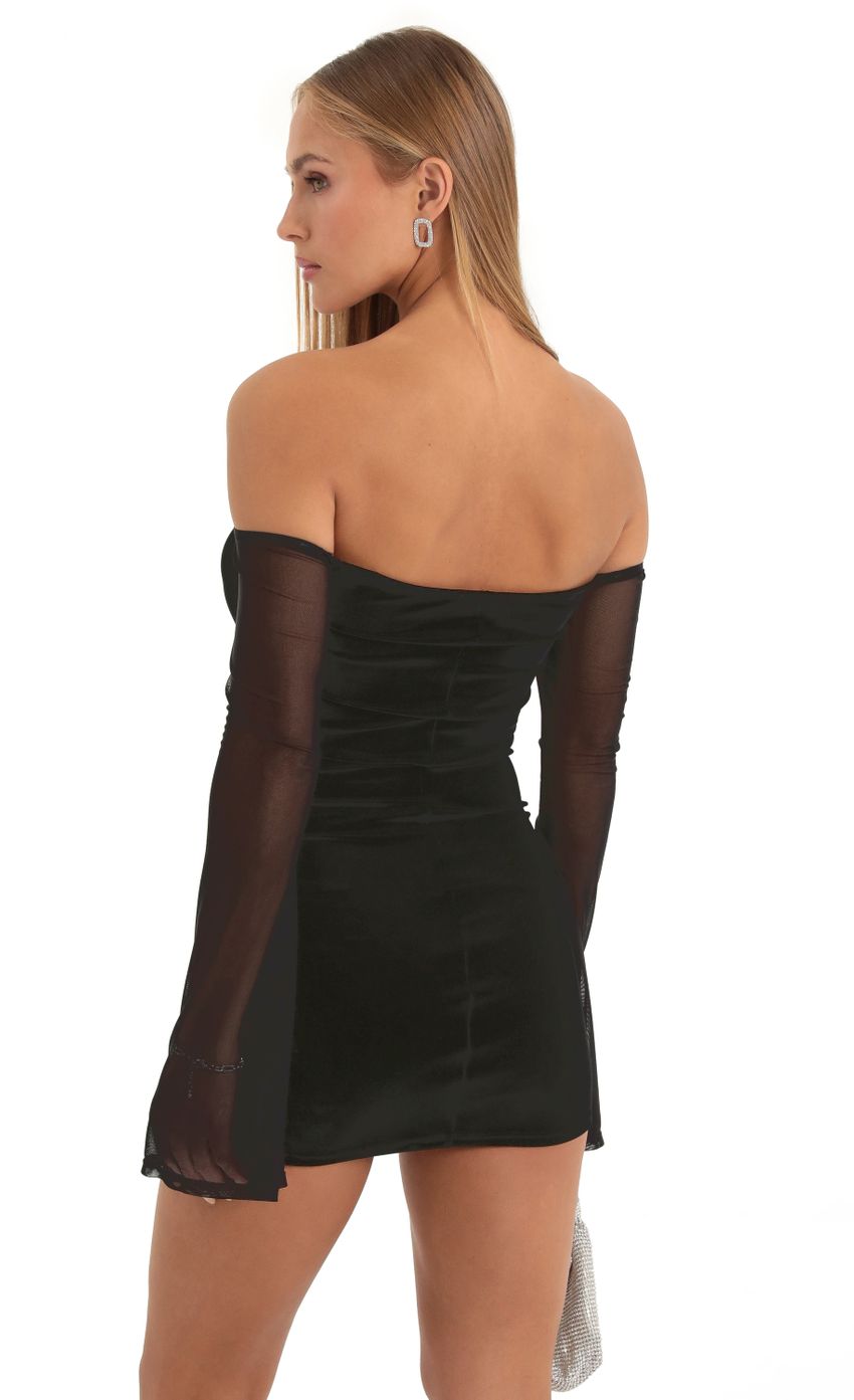 Picture Velvet Off The Shoulder Dress in Black. Source: https://media-img.lucyinthesky.com/data/Dec22/850xAUTO/c92e04c3-6bf2-49e6-b6cd-d0ee4f8ba09b.jpg