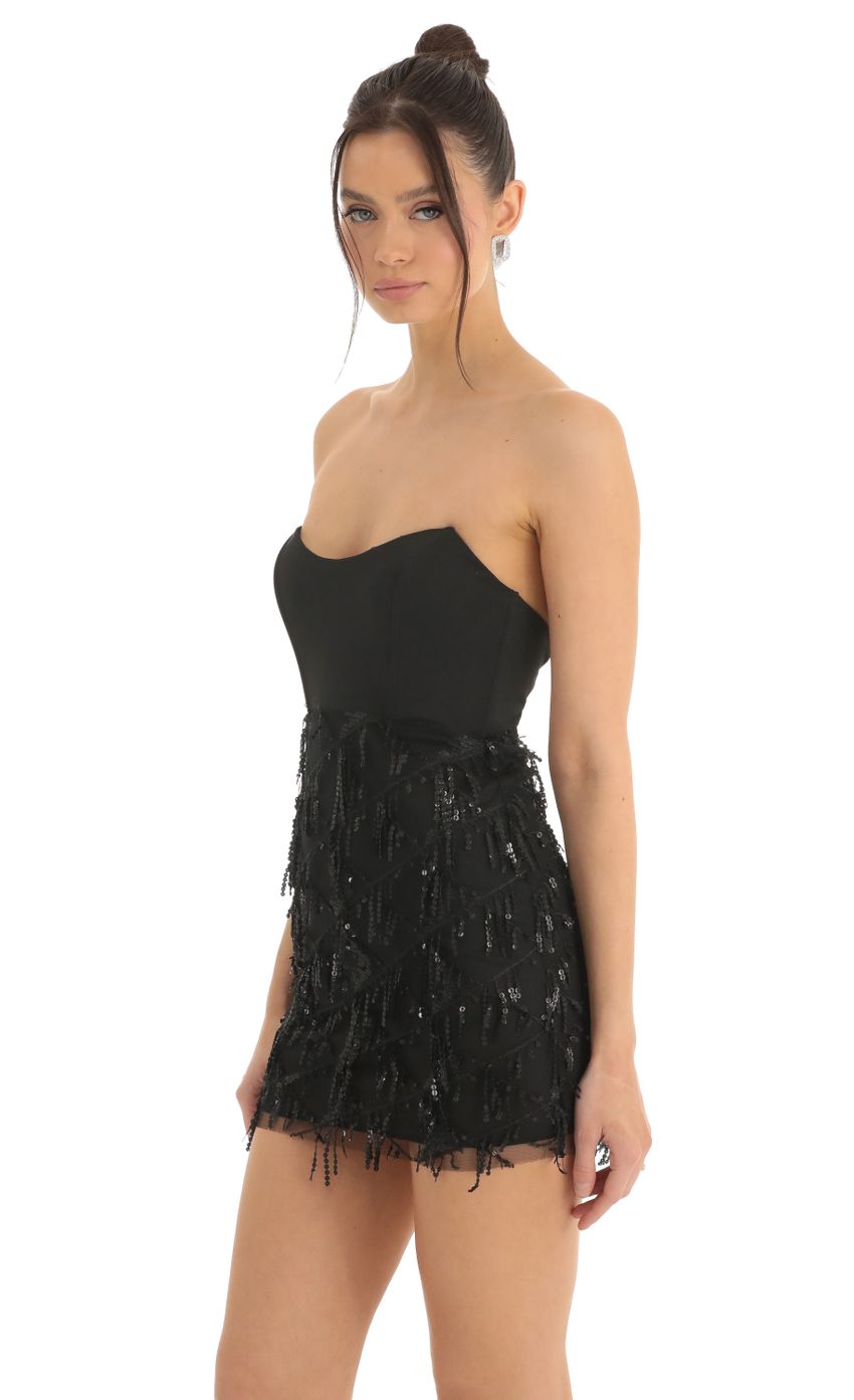 Picture Dangling Sequin Corset Dress in Black. Source: https://media-img.lucyinthesky.com/data/Dec22/850xAUTO/cbc8b283-6658-4fee-a370-db21b2119508.jpg