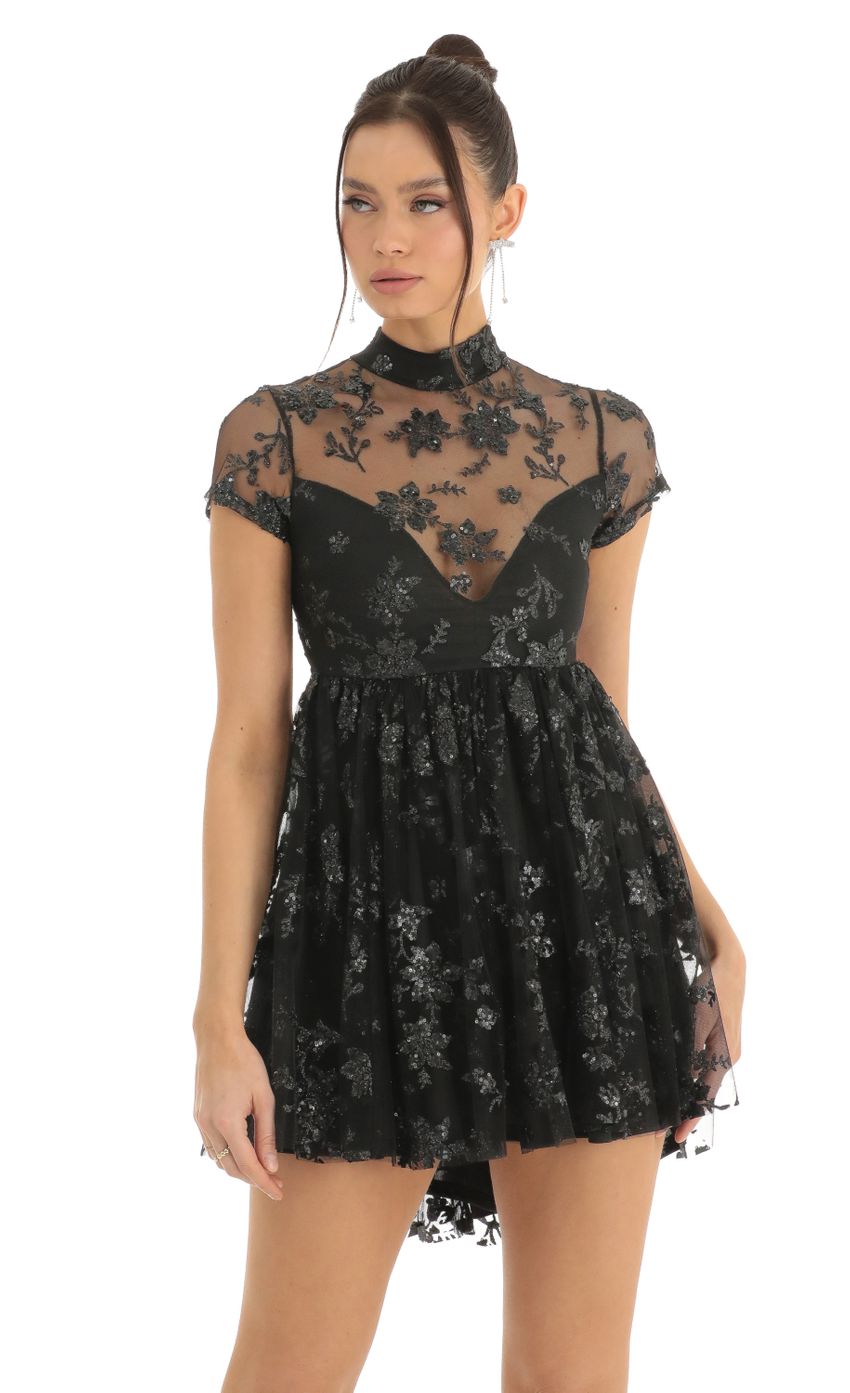 Picture Floral Sequin Baby Doll Dress in Black. Source: https://media-img.lucyinthesky.com/data/Dec22/850xAUTO/e08a9717-150a-45be-8fc0-f5b394a98529.jpg