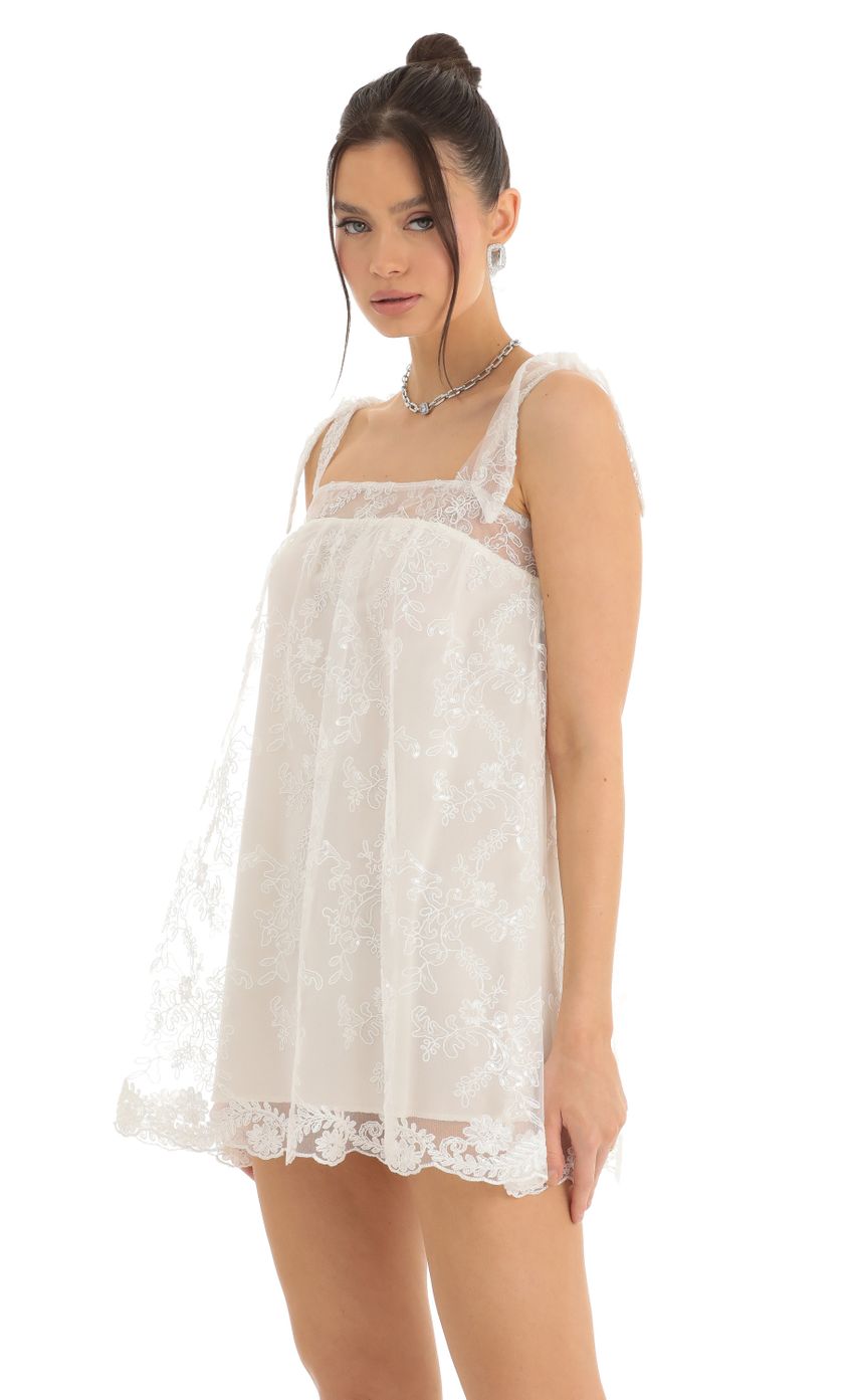 Picture Tulle Sequin Shift Dress in White. Source: https://media-img.lucyinthesky.com/data/Dec22/850xAUTO/ef43941c-009b-44ef-9528-608d41996ecb.jpg