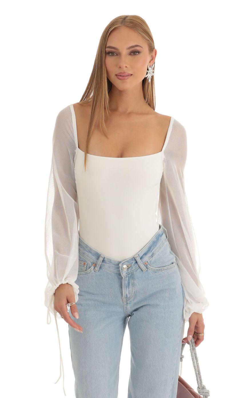 Picture Mesh Long Sleeve Bodysuit in White. Source: https://media-img.lucyinthesky.com/data/Dec22/850xAUTO/efba8f34-f4f9-45b4-9fa0-597aaefcc5a3.jpg