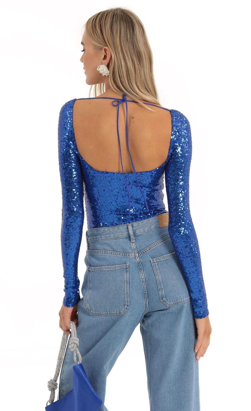 Picture Sequin Long Sleeve Bodysuit in Blue. Source: https://media-img.lucyinthesky.com/data/Dec22/850xAUTO/f1374d70-92a9-4019-b465-9567568f395a.jpg