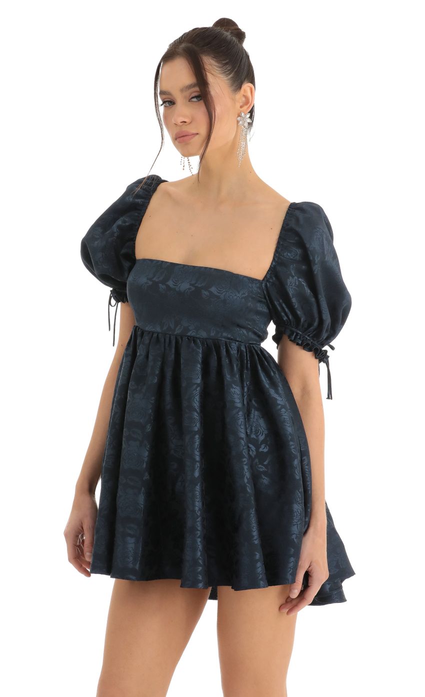 Picture Floral Jacquard Baby Dolly Dress in Navy. Source: https://media-img.lucyinthesky.com/data/Dec22/850xAUTO/ffde423f-4845-466d-aab9-f59cfe81c7fc.jpg