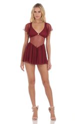 Picture Dotted Mesh Cutout Dress in Maroon. Source: https://media-img.lucyinthesky.com/data/Dec23/150xAUTO/dc1e044f-20ff-4336-ad82-9f982c49c755.jpg
