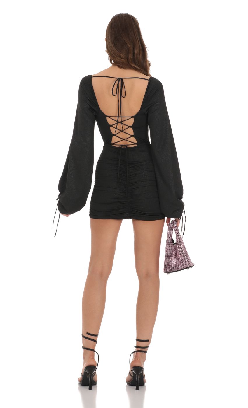 Picture Shimmer Long Sleeve Corset Dress in Black. Source: https://media-img.lucyinthesky.com/data/Dec23/850xAUTO/3026950c-77ac-403f-b11c-bdca225b7381.jpg