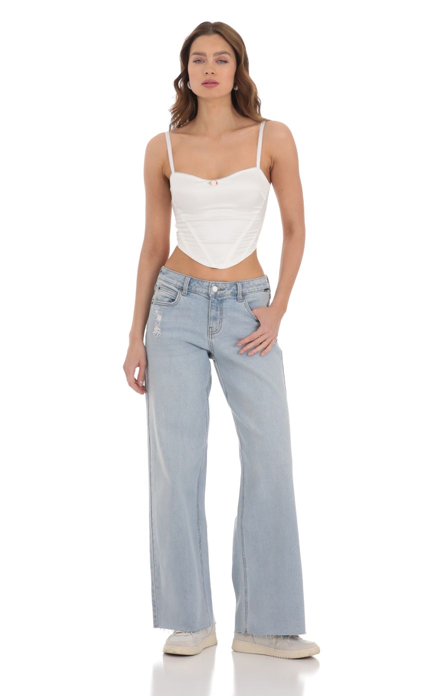 Picture Wide Leg Jeans in Light Denim. Source: https://media-img.lucyinthesky.com/data/Dec23/850xAUTO/3d110f0b-3ce3-41e7-bc34-f9c227316134.jpg