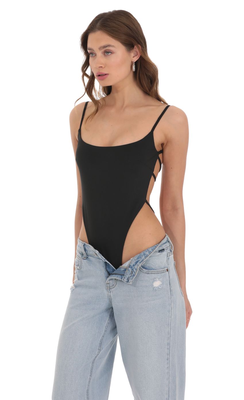 Picture Open Back Strappy Bodysuit in Black. Source: https://media-img.lucyinthesky.com/data/Dec23/850xAUTO/85aebd46-69c2-4324-a644-9b3d53fa05ad.jpg