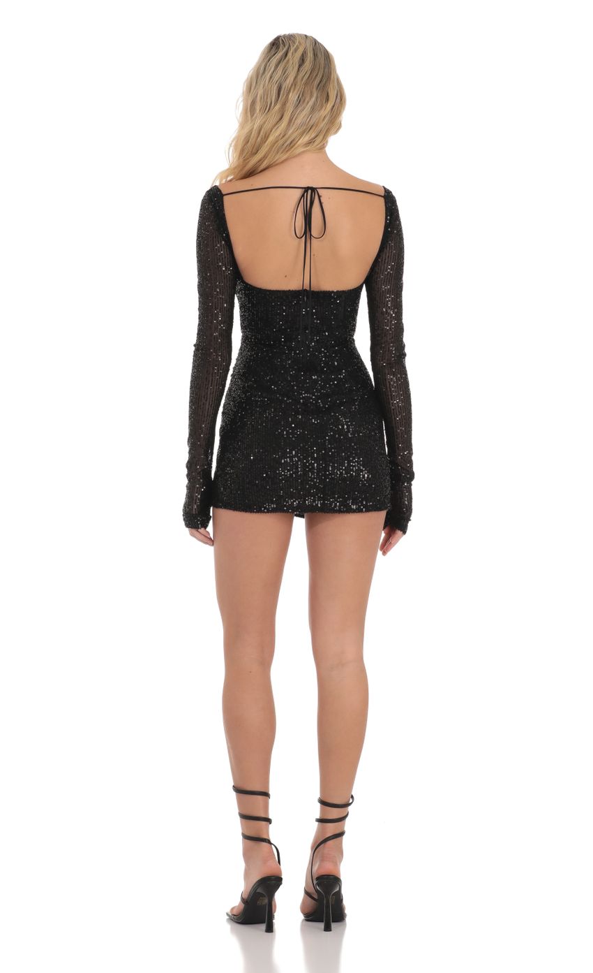 Picture Sequin V-Neck Long Sleeve Dress in Black. Source: https://media-img.lucyinthesky.com/data/Dec23/850xAUTO/86e4b681-e585-4796-907c-1d0879944ccc.jpg