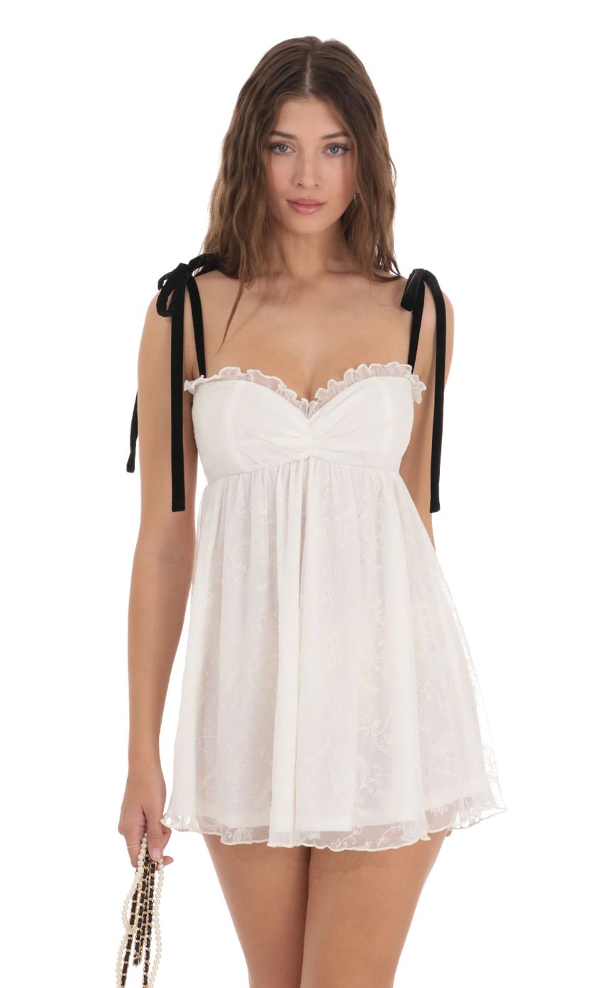 Picture Mesh Velvet Shoulder Ties Babydoll Dress in White. Source: https://media-img.lucyinthesky.com/data/Dec23/850xAUTO/b264d349-b8cd-4446-b403-2ef61dd2d5fe.jpg
