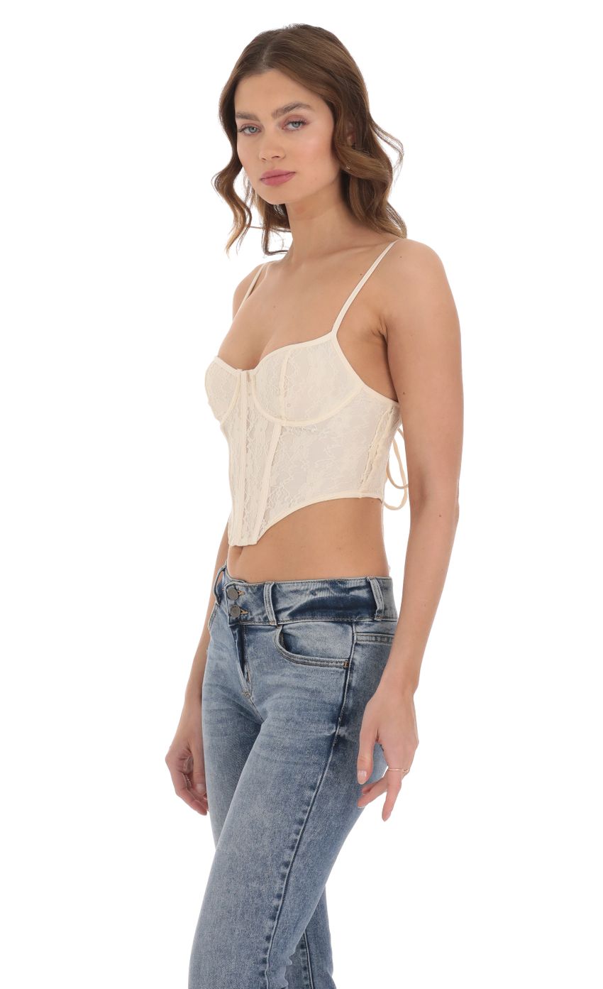 Picture Lace Corset Top in Cream. Source: https://media-img.lucyinthesky.com/data/Dec23/850xAUTO/c88b28c7-8cde-4912-86ae-a09c89d2f26f.jpg