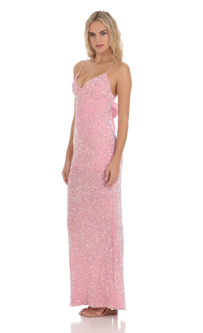 Picture Velvet Sequin Back Bow Maxi Dress in Pink. Source: https://media-img.lucyinthesky.com/data/Dec23/850xAUTO/f68c6a00-dbb5-4df3-af91-7792540170c3.jpg