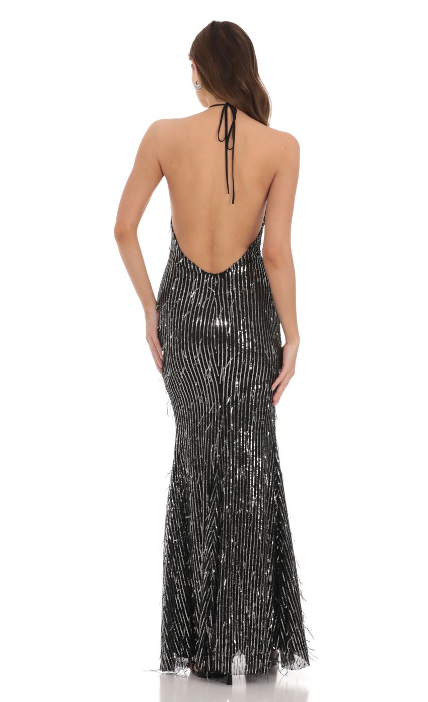 Picture Silver Fringe Sequin Halter Maxi Dress in Black. Source: https://media-img.lucyinthesky.com/data/Dec23/850xAUTO/fb766ea5-5e92-4e03-8e87-c54cf1d14016.jpg