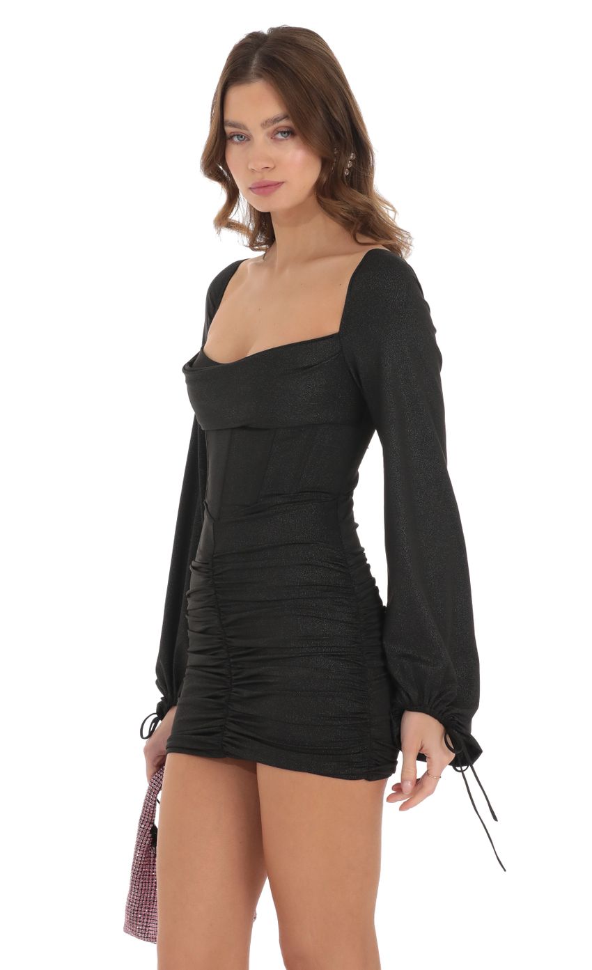 Picture Shimmer Long Sleeve Corset Dress in Black. Source: https://media-img.lucyinthesky.com/data/Dec23/850xAUTO/fe1d874a-1449-4e79-92e8-a38c8294fda5.jpg