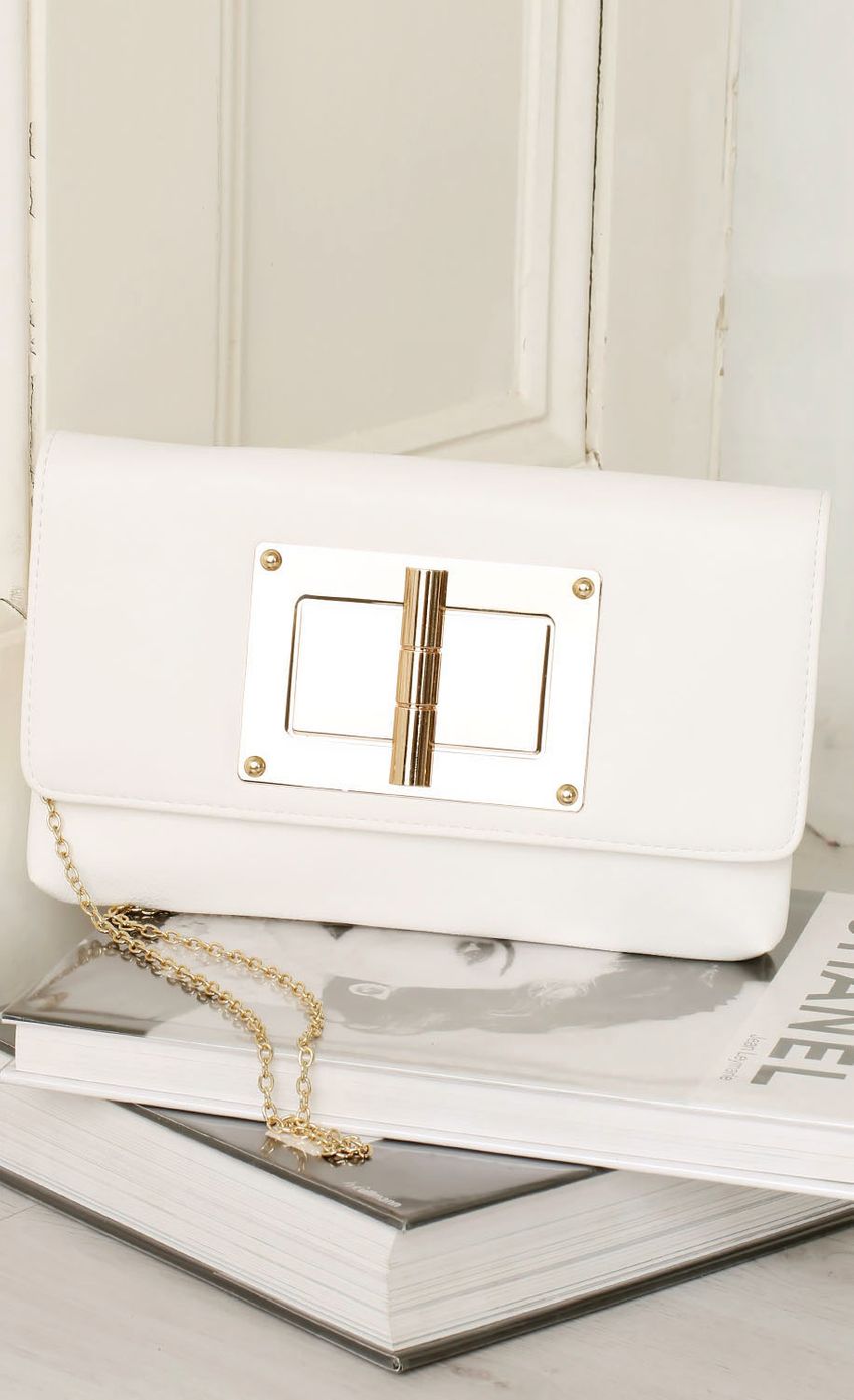 Picture White and Gold Accented Clutch. Source: https://media-img.lucyinthesky.com/data/Feb15_2/850xAUTO/0Y5A7777.JPG