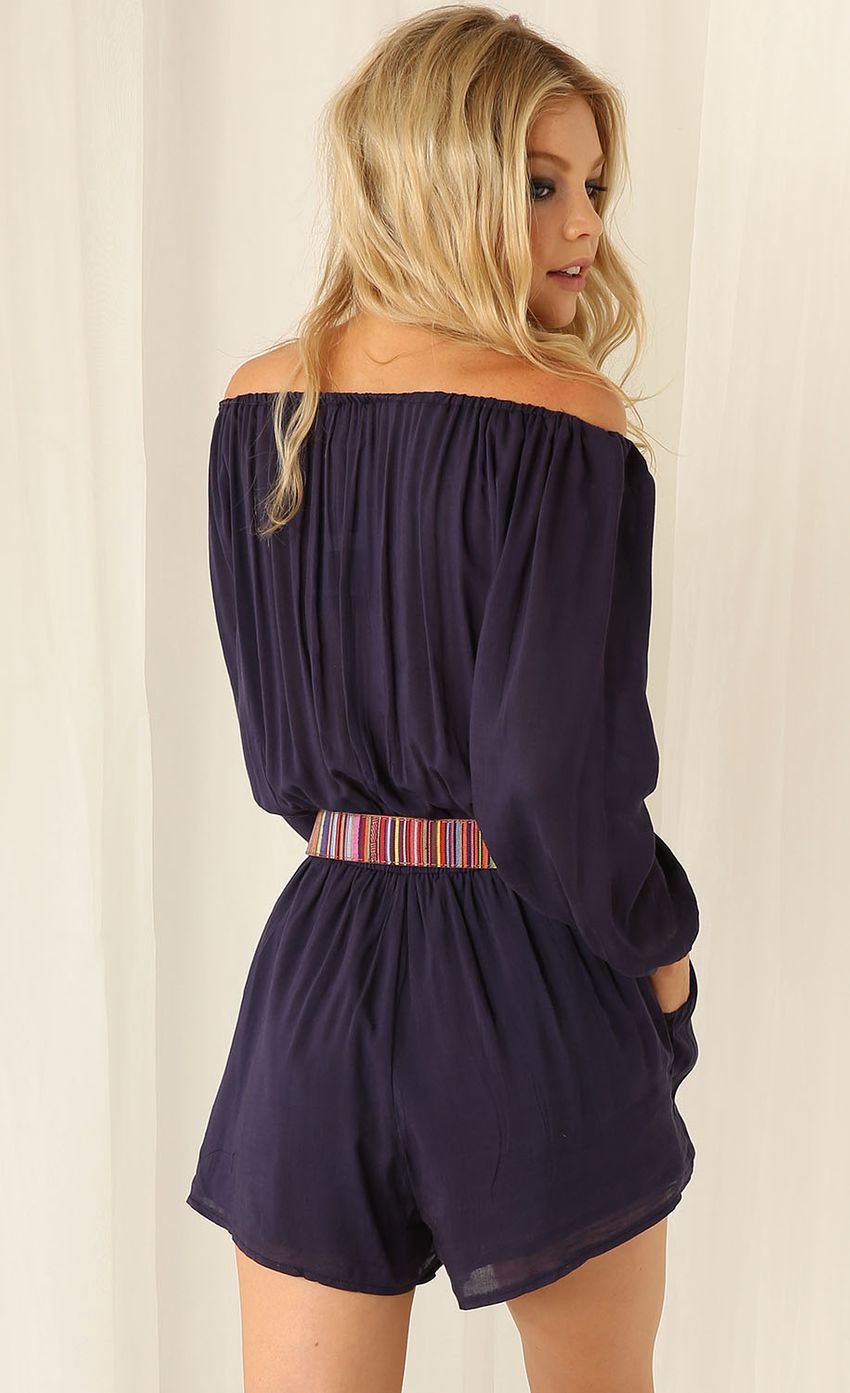 Picture BLUE OFF THE SHOULDER PLAYSUIT. Source: https://media-img.lucyinthesky.com/data/Feb15_2/850xAUTO/0Y5A7843.JPG