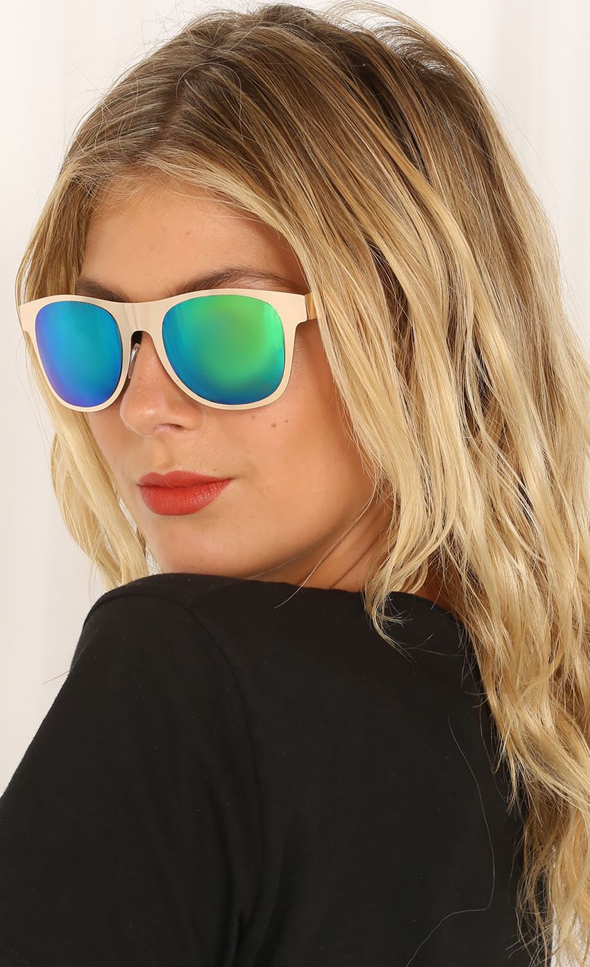 Picture Gold and Green Reflective Shades. Source: https://media-img.lucyinthesky.com/data/Feb15_2/850xAUTO/0Y5A7872.JPG