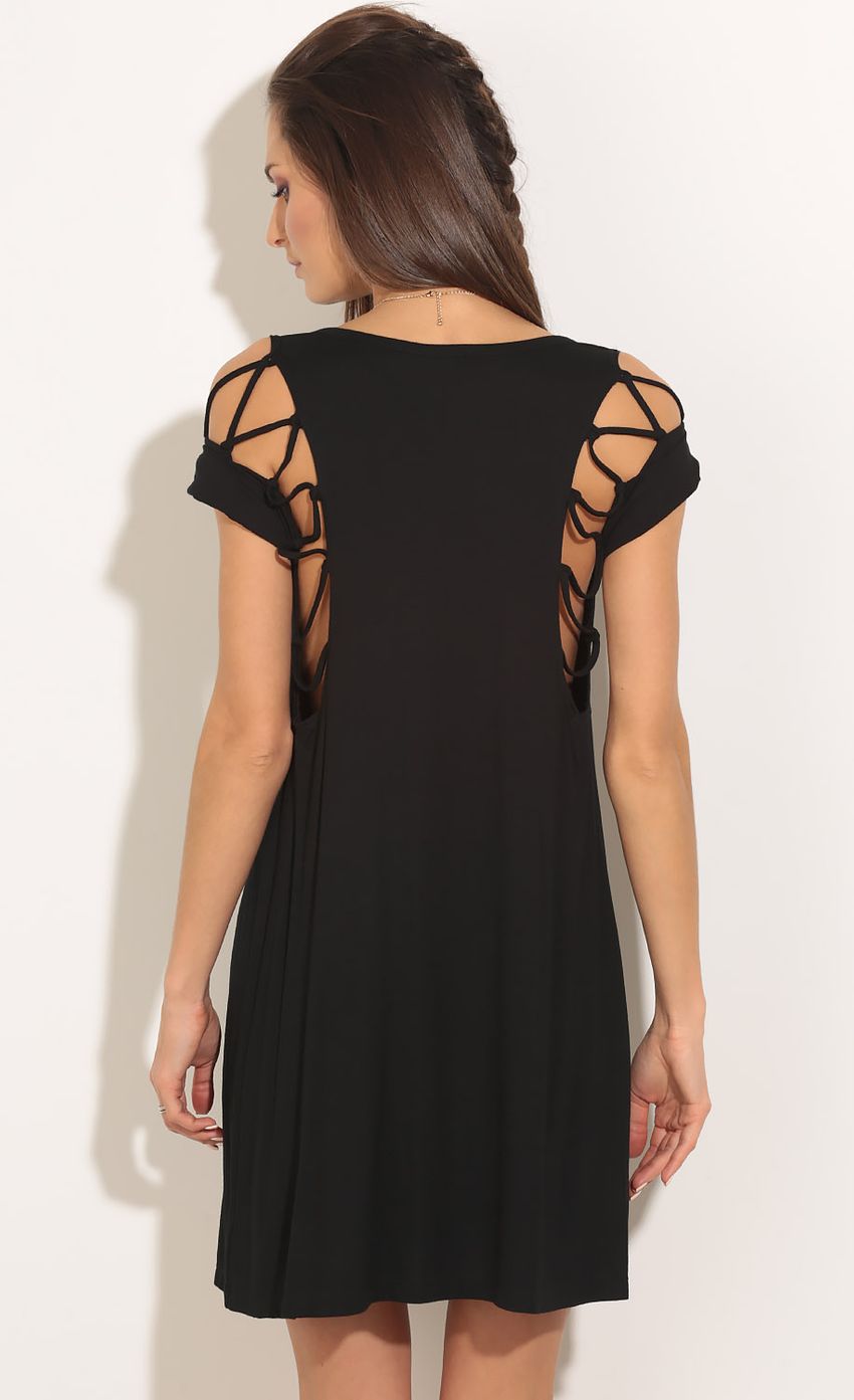 Picture Peek-A-Boo Shoulder Shift Dress In Black. Source: https://media-img.lucyinthesky.com/data/Feb16_1/850xAUTO/0Y5A6649.JPG