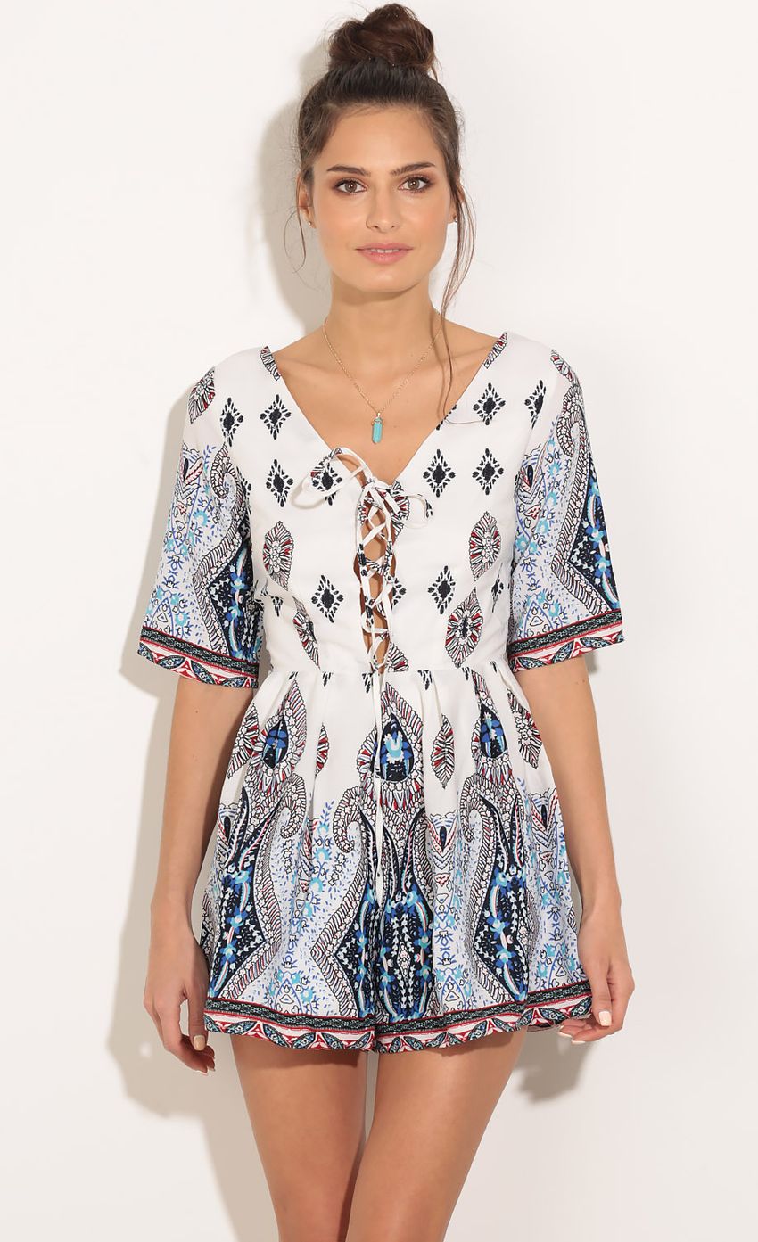 Picture Bohemian Inspired Lace-Up Romper In Blue. Source: https://media-img.lucyinthesky.com/data/Feb16_1/850xAUTO/0Y5A7604.JPG