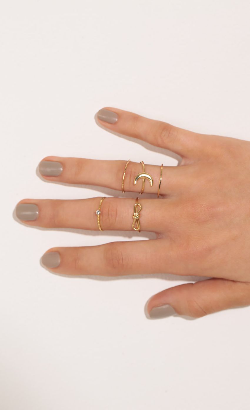 Picture Multi-Finger Five Piece Ring Set In Gold. Source: https://media-img.lucyinthesky.com/data/Feb17_1/850xAUTO/0Y5A7164.JPG