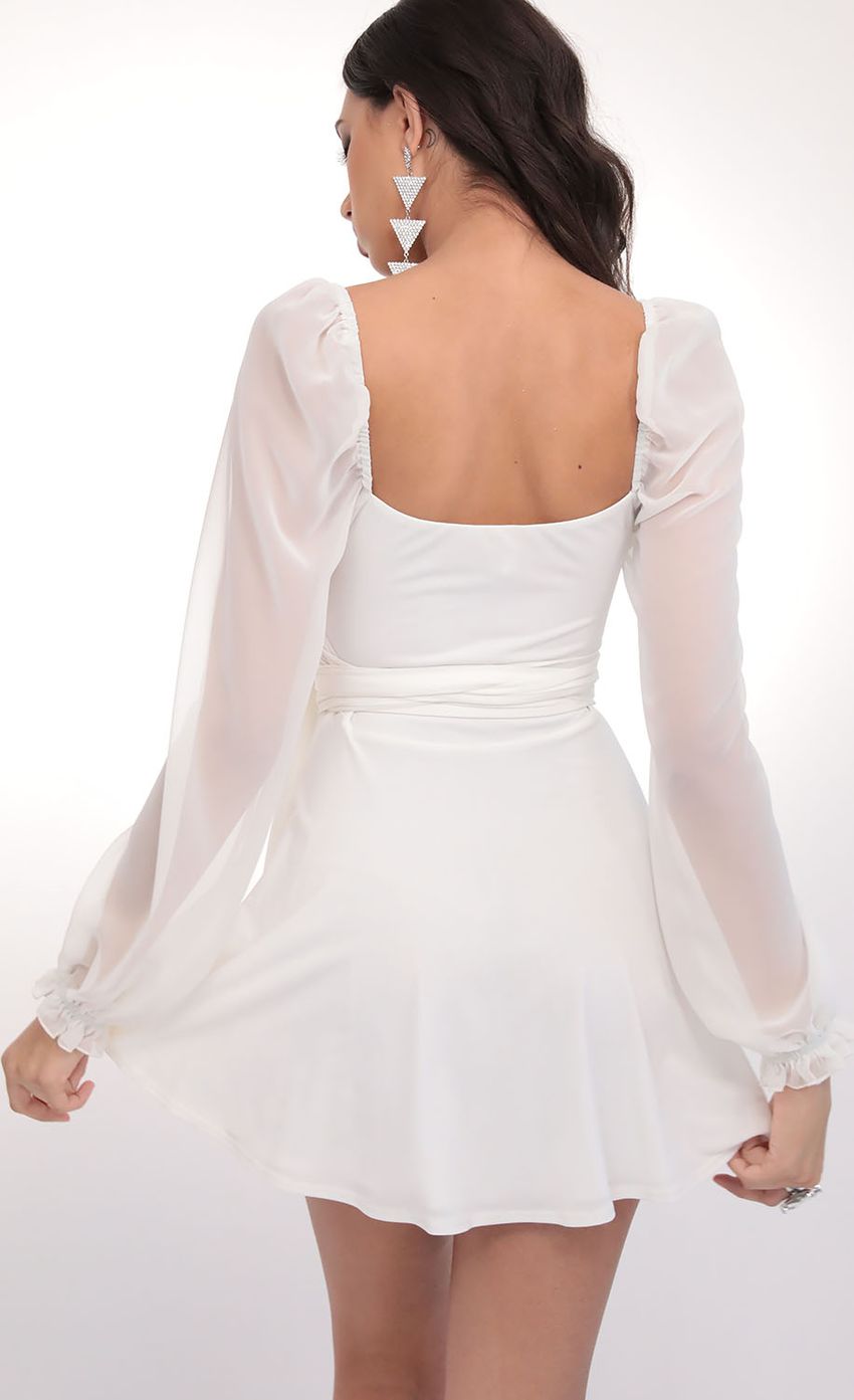 Picture Puff Chiffon Wrap Dress in Ivory. Source: https://media-img.lucyinthesky.com/data/Feb20_1/850xAUTO/781A7759.JPG