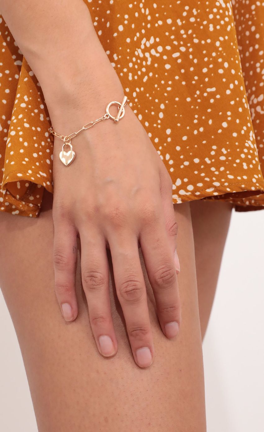Picture Love Linked Bracelet in Gold. Source: https://media-img.lucyinthesky.com/data/Feb21_1/850xAUTO/1V9A4555.JPG