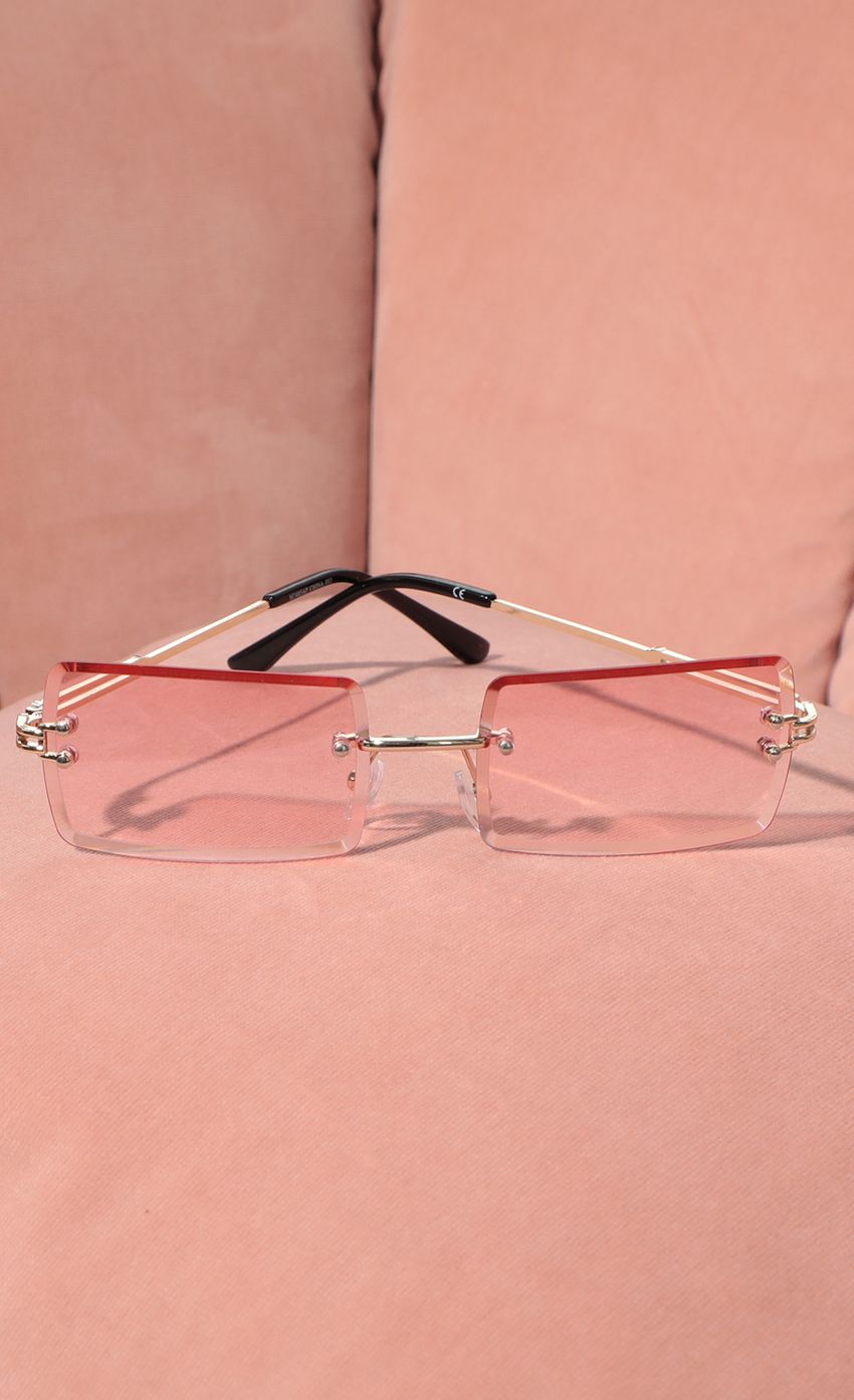 Picture 90s Baby Rectangle Sunglasses in Pink. Source: https://media-img.lucyinthesky.com/data/Feb21_1/850xAUTO/AT2A9302.JPG