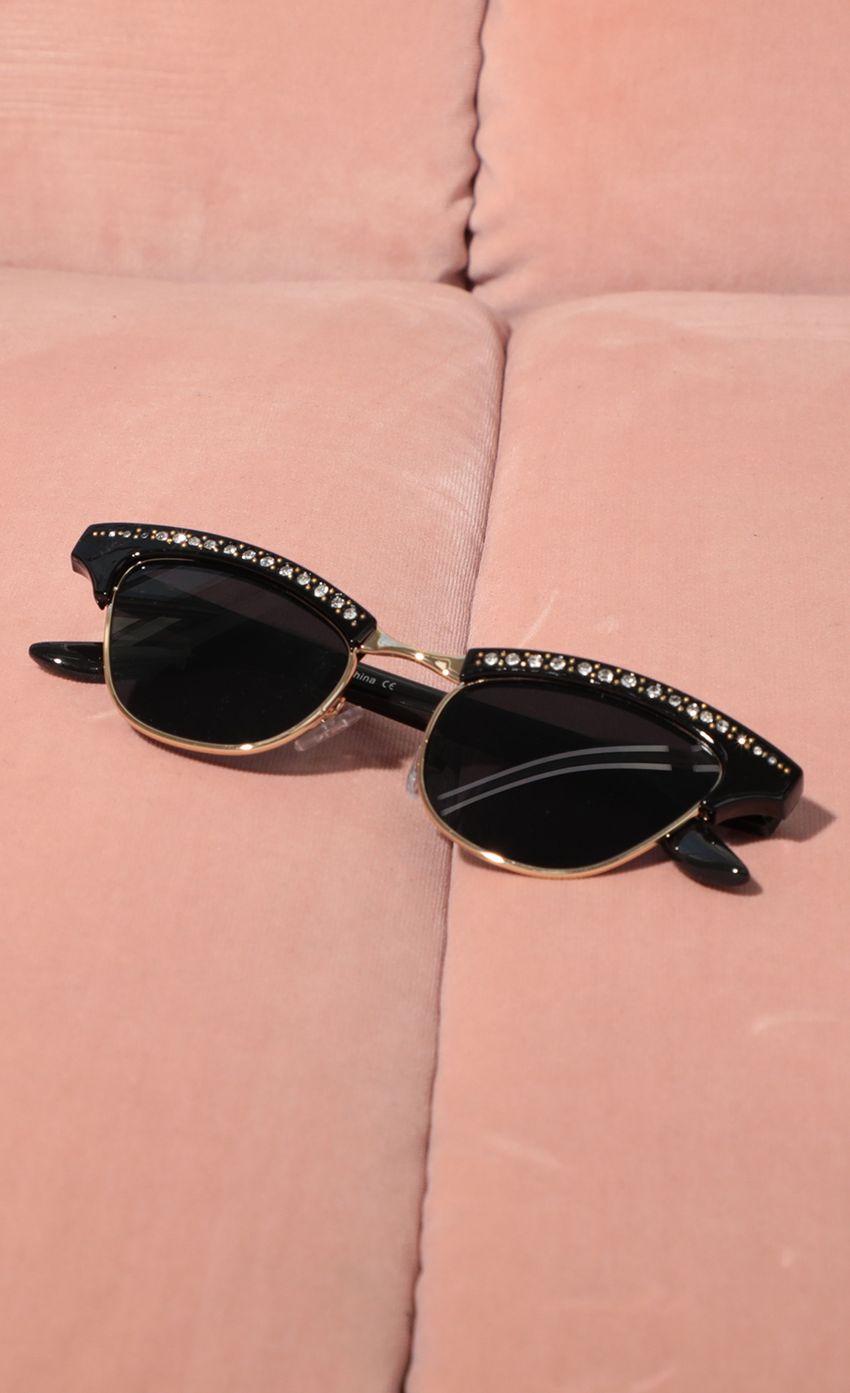 Picture Alexis Cat-Eye Sunglasses in All Black. Source: https://media-img.lucyinthesky.com/data/Feb21_1/850xAUTO/AT2A9429.JPG
