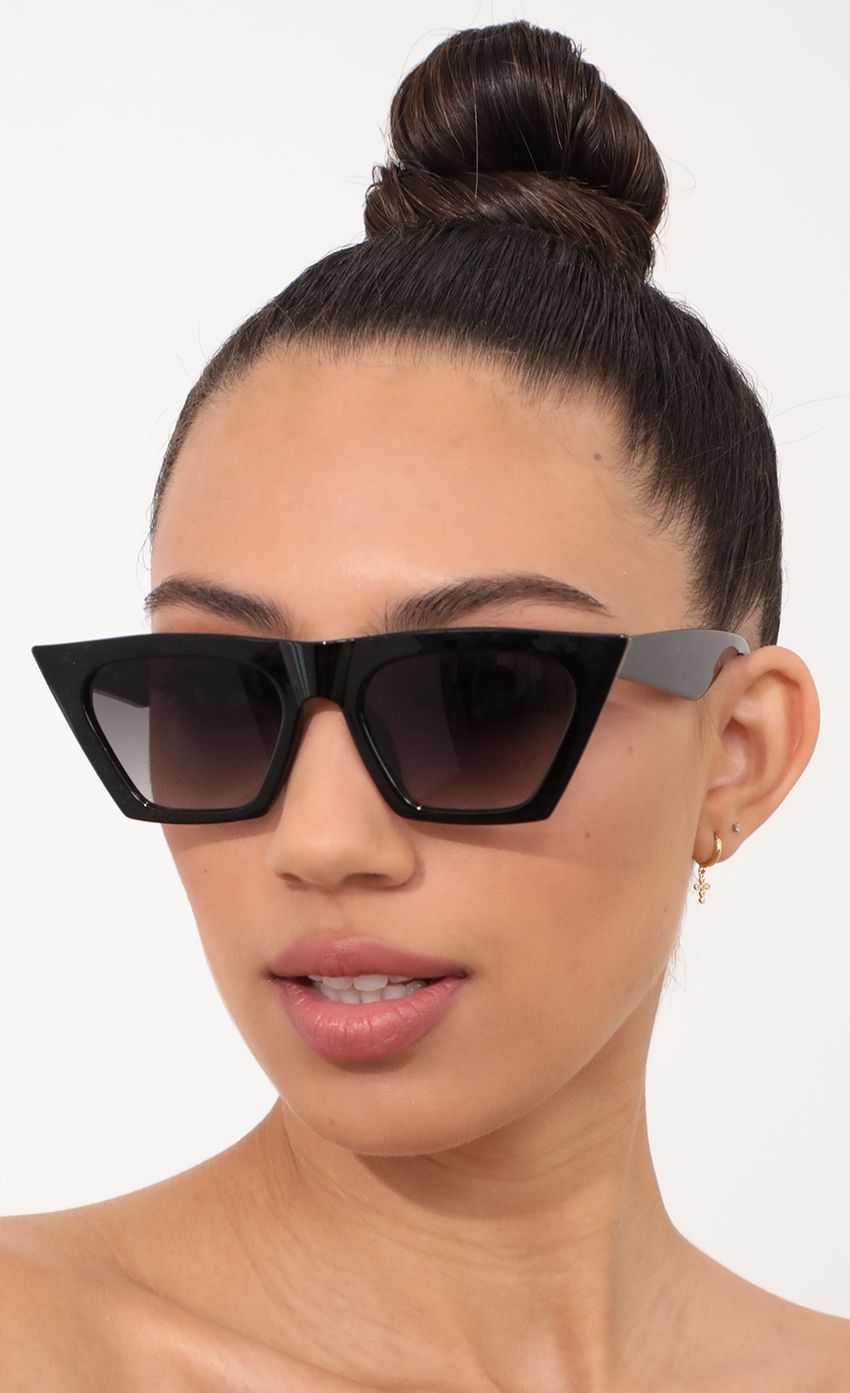 Picture Phoebe Square Cat-Eye Sunglasses in Black. Source: https://media-img.lucyinthesky.com/data/Feb21_2/850xAUTO/AT2A1445_COPY.JPG