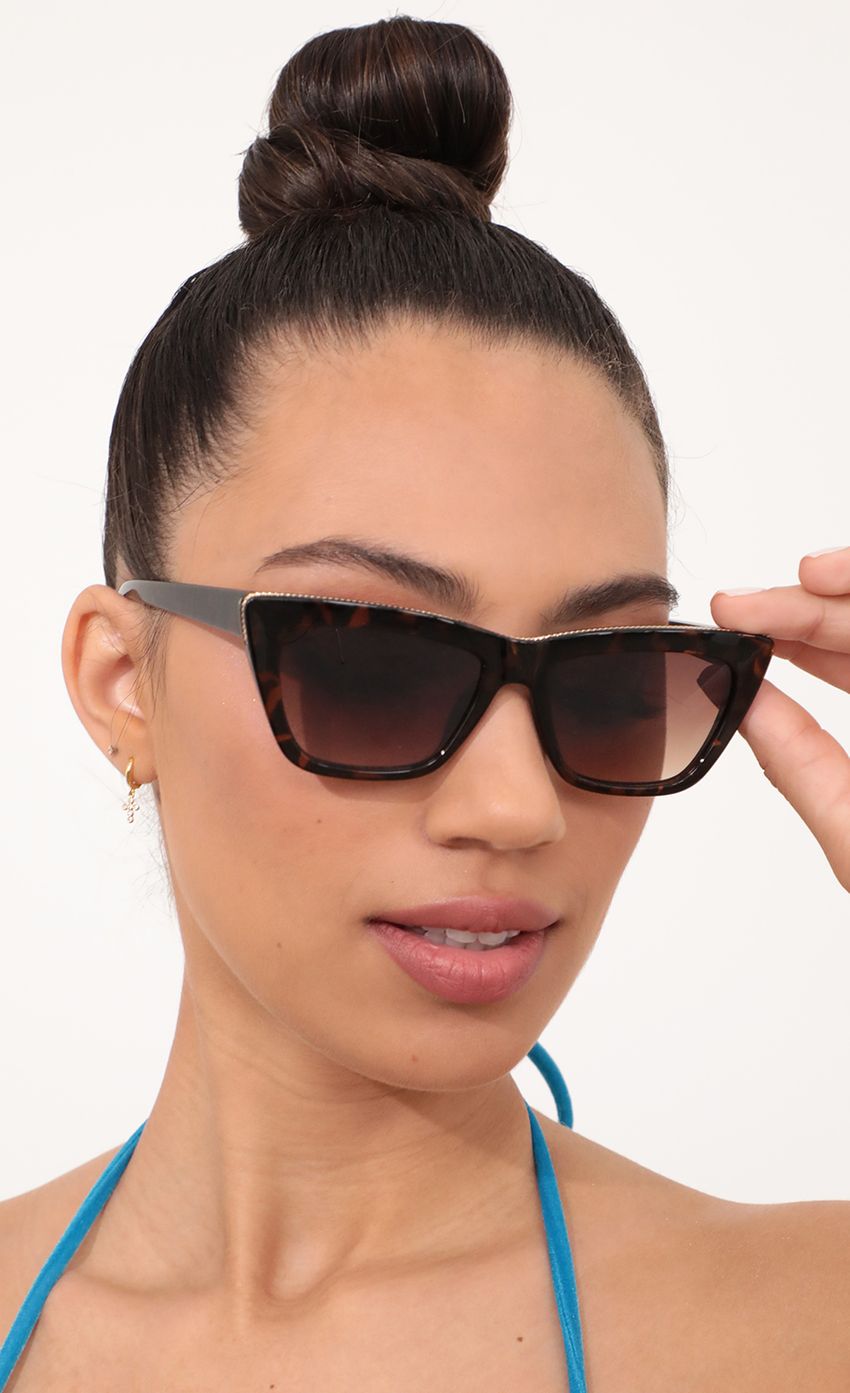 Picture Edge Sunglasses in All Havana Brown. Source: https://media-img.lucyinthesky.com/data/Feb21_2/850xAUTO/AT2A1631_COPY.JPG