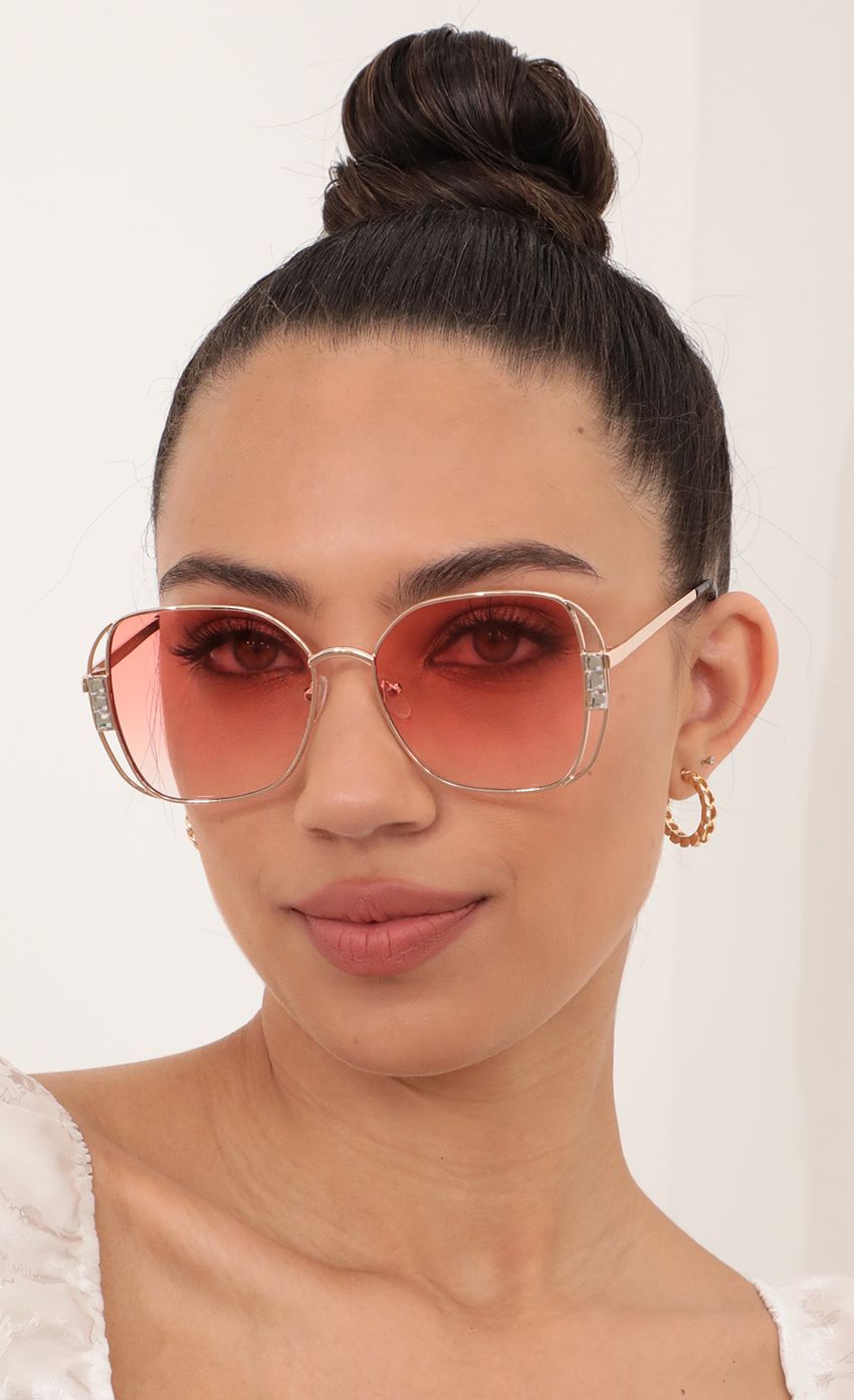 Picture Chloe Retro-Inspired Sunglasses in Coral. Source: https://media-img.lucyinthesky.com/data/Feb21_2/850xAUTO/AT2A5900_COPY.JPG