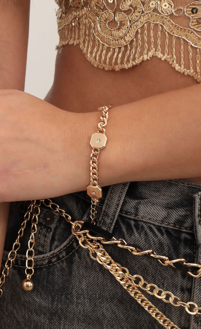Picture Starburst Chain Bracelet in Gold. Source: https://media-img.lucyinthesky.com/data/Feb21_2/850xAUTO/AT2A6592_COPY.JPG