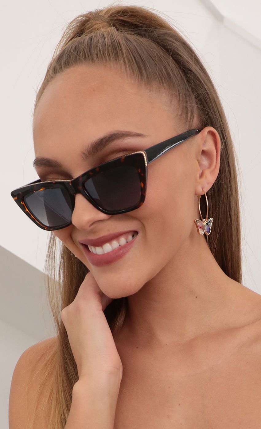 Picture Edge Sunglasses in Havana Brown. Source: https://media-img.lucyinthesky.com/data/Feb21_2/850xAUTO/AT2A8280_COPY1.JPG