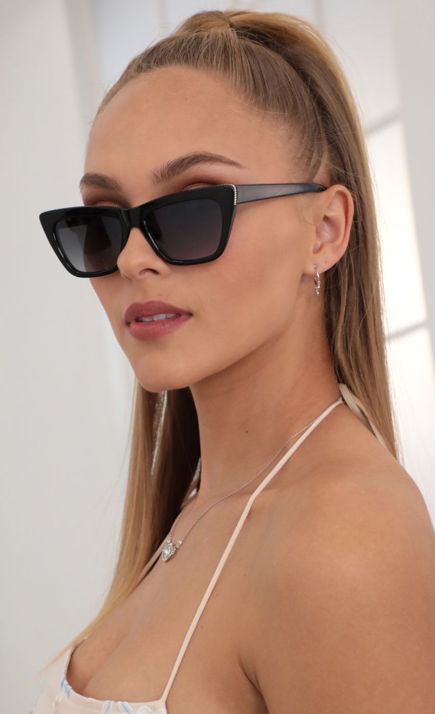 Picture Edge Sunglasses in Black. Source: https://media-img.lucyinthesky.com/data/Feb21_2/850xAUTO/AT2A9209.JPG