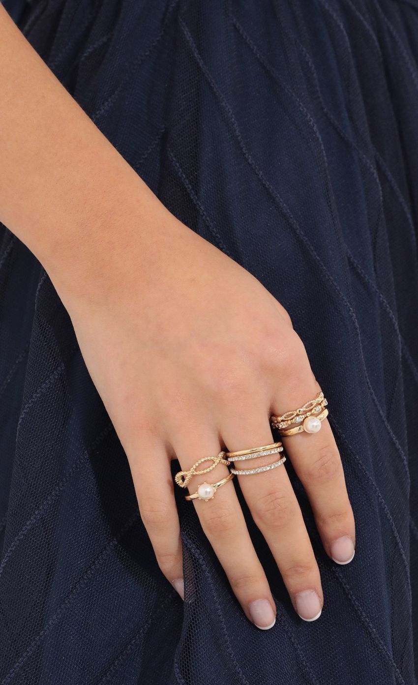 Picture Angel Status Ring Set in Gold. Source: https://media-img.lucyinthesky.com/data/Feb22_2/850xAUTO/1V9A0933.JPG