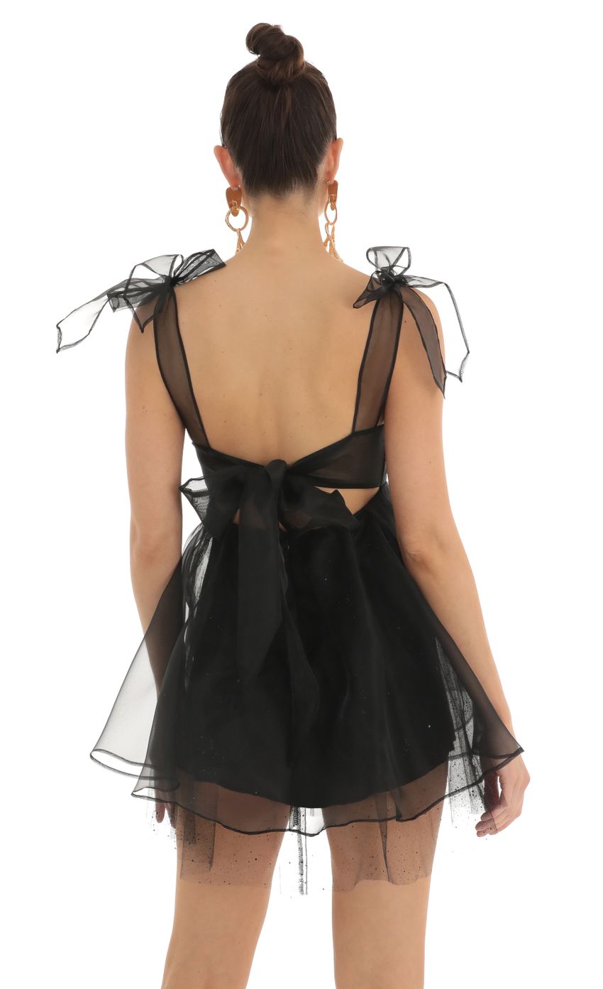Picture Glitter Bow Baby Doll Dress in Black. Source: https://media-img.lucyinthesky.com/data/Feb23/850xAUTO/0bf6cb9d-961e-4396-9ee4-f3a4b381eefb.jpg