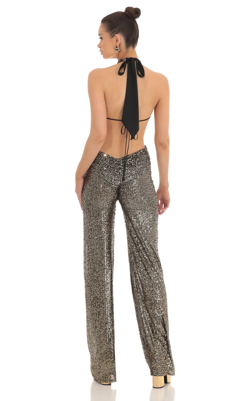 Picture Sequin Plunge Halter Jumpsuit in Gold. Source: https://media-img.lucyinthesky.com/data/Feb23/850xAUTO/15824f54-01e4-4904-a05e-75cd804d111e.jpg