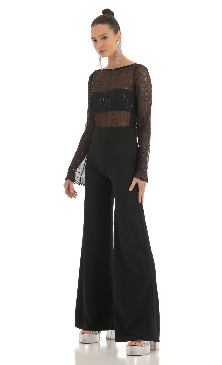 Picture Sequin Striped Long Sleeve Jumpsuit in Black. Source: https://media-img.lucyinthesky.com/data/Feb23/850xAUTO/2fcb3966-1453-423e-b2af-fd3fe269845b.jpg