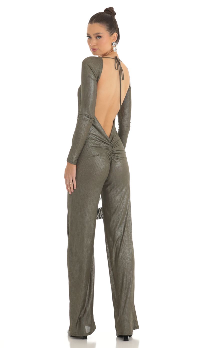 Picture Shimmer Open Back Long Sleeve Jumpsuit in Olive. Source: https://media-img.lucyinthesky.com/data/Feb23/850xAUTO/4fa72a7e-600d-4534-9be9-2b4db9d8ce49.jpg