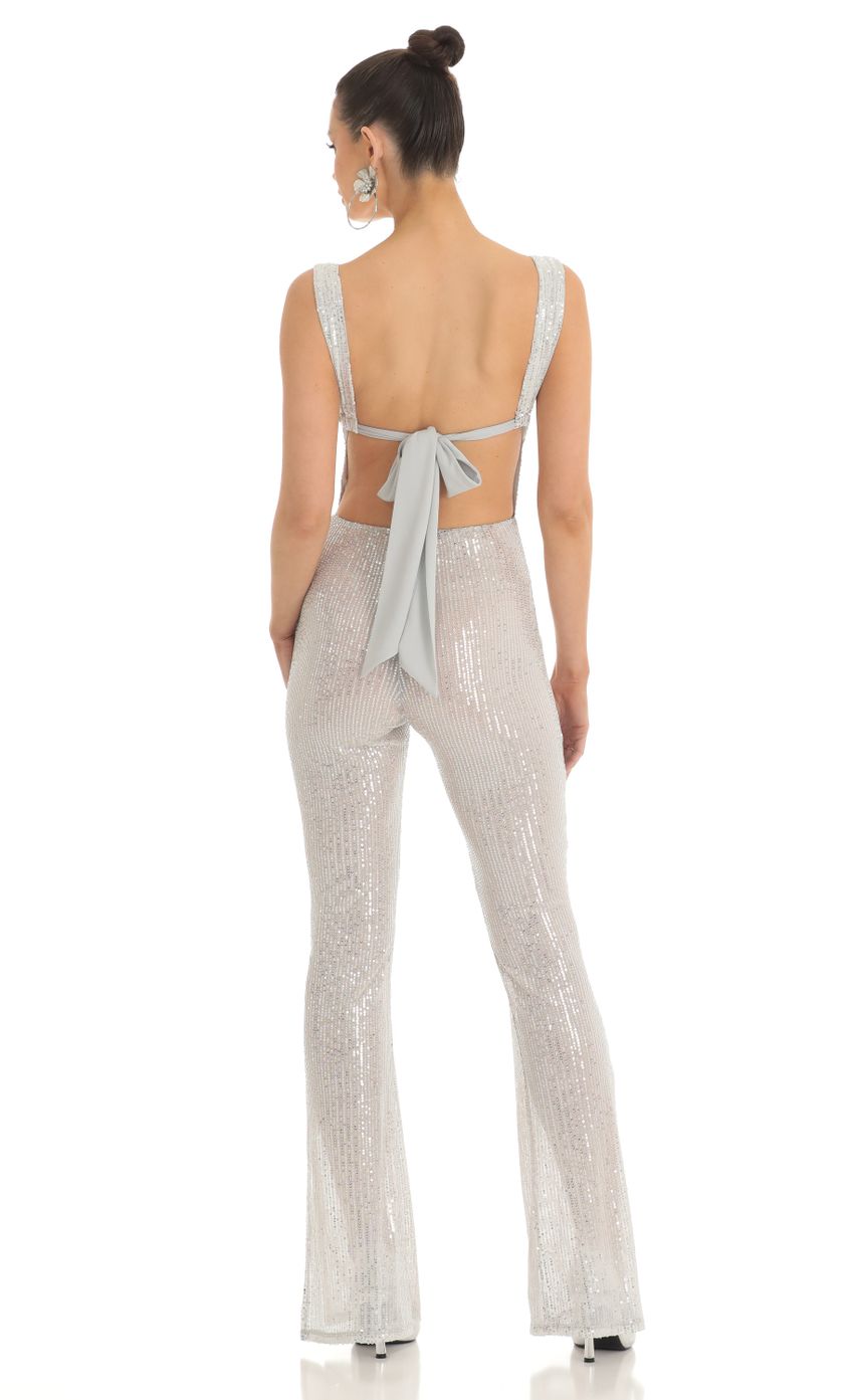 Picture Sequin Wide Leg Slit Jumpsuit in Silver. Source: https://media-img.lucyinthesky.com/data/Feb23/850xAUTO/5b41e565-fbb2-415f-827a-bfb00b7e0f37.jpg