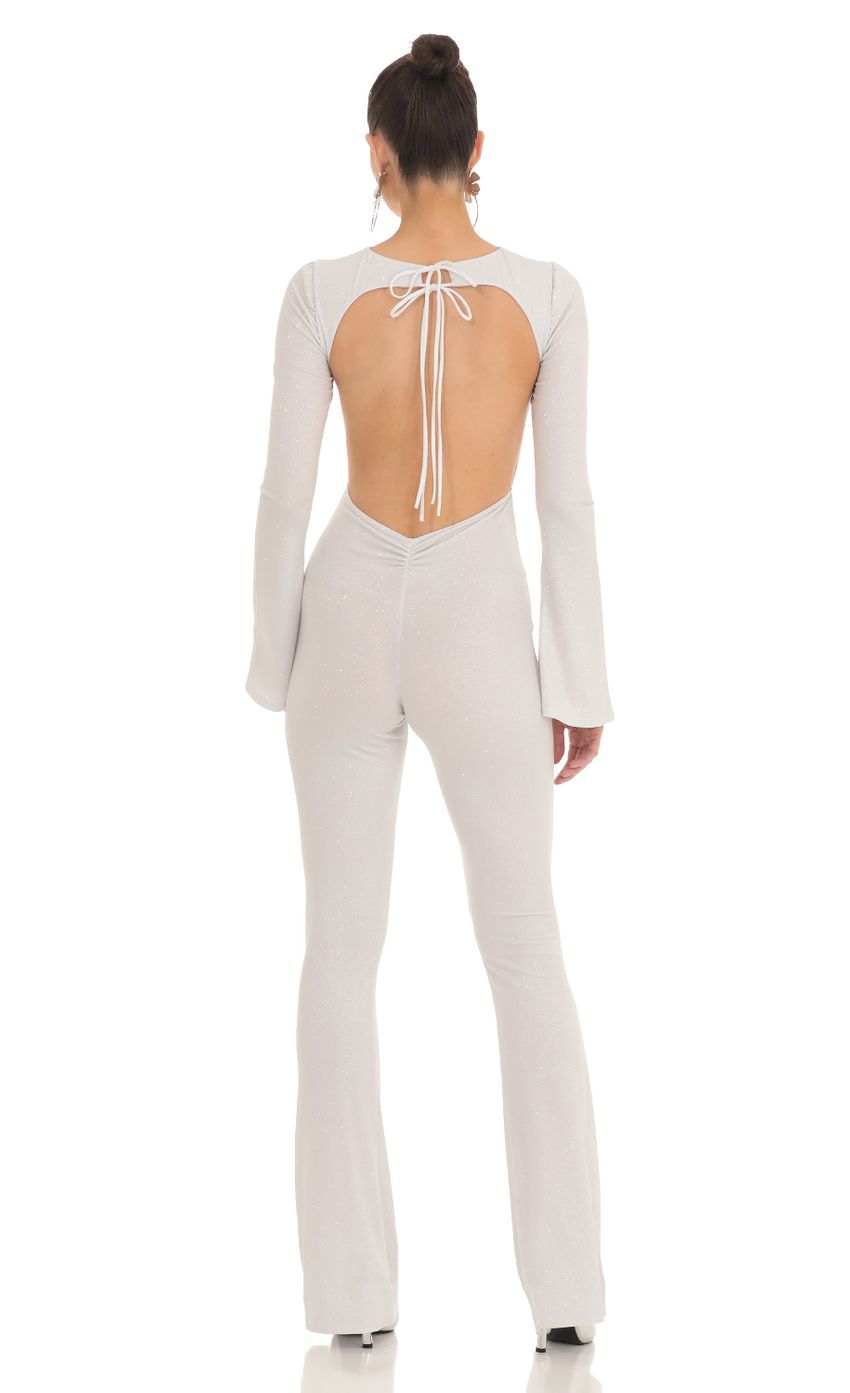 Picture Silver Shimmer Open Back Jumpsuit in White. Source: https://media-img.lucyinthesky.com/data/Feb23/850xAUTO/6aa83f87-edc0-4c82-b881-468f537ada88.jpg