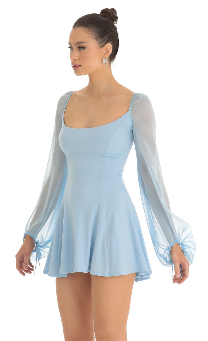Picture Sheer Sleeve Dress in Light Blue. Source: https://media-img.lucyinthesky.com/data/Feb23/850xAUTO/72a14125-5f0f-4d15-a206-d79275f6d2e2.jpg