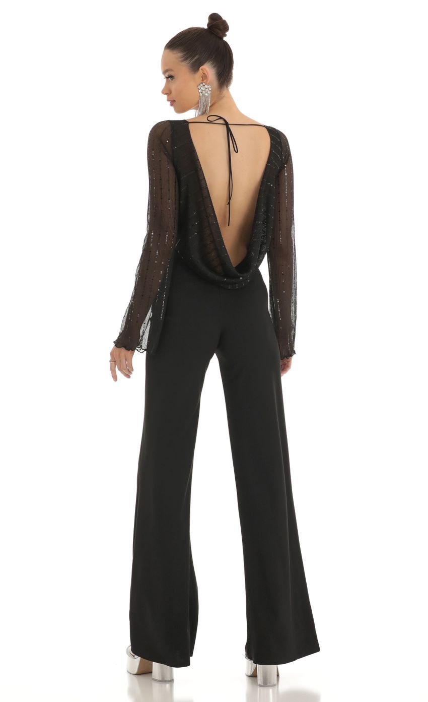 Picture Sequin Striped Long Sleeve Jumpsuit in Black. Source: https://media-img.lucyinthesky.com/data/Feb23/850xAUTO/74212d42-5153-450e-81cf-736bb4fd89d0.jpg