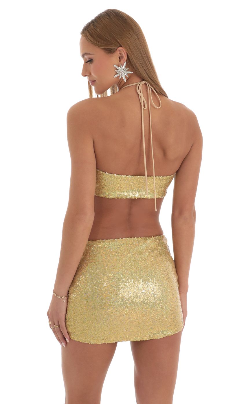 Picture Iridescent Sequin Halter Dress in Gold. Source: https://media-img.lucyinthesky.com/data/Feb23/850xAUTO/75d59ee3-f18c-4fe5-8fa0-4f1bb6d10f5b.jpg