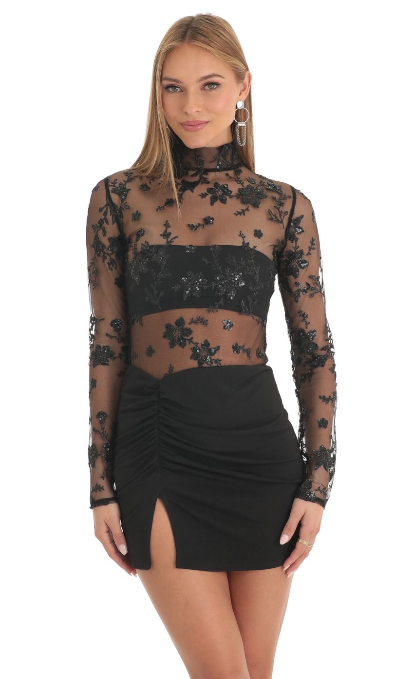Picture Tulle Glitter Sheer Mock Neck Dress in Black. Source: https://media-img.lucyinthesky.com/data/Feb23/850xAUTO/79e00fe7-0db9-44e0-a7f6-6ebb22266fb5.jpg