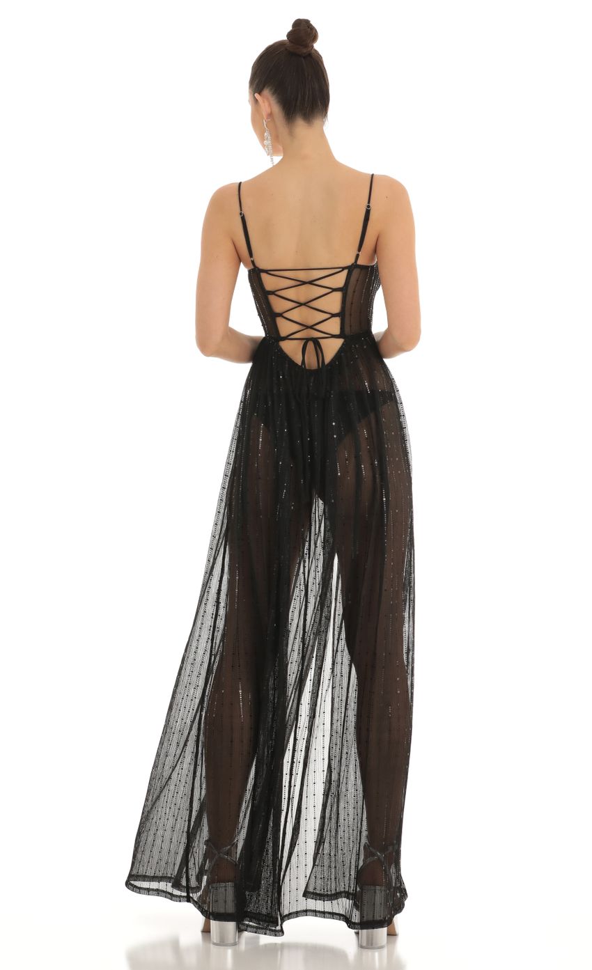 Picture Adema Metallic Knit Maxi Dress in Black. Source: https://media-img.lucyinthesky.com/data/Feb23/850xAUTO/83e2ef36-4381-47a7-9f13-3f15afbed2e2.jpg
