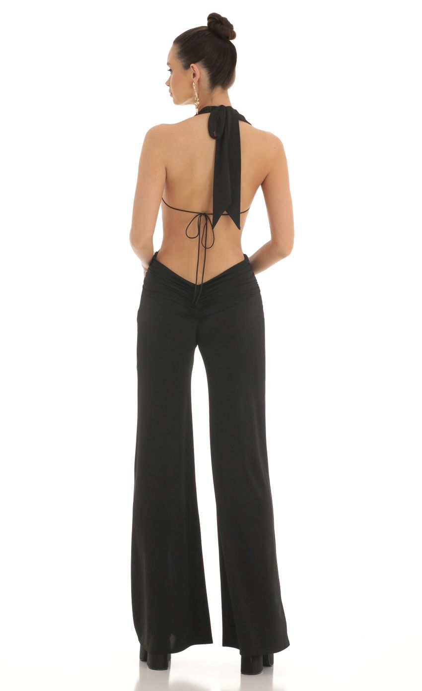Picture Plunge Halter Jumpsuit in Black. Source: https://media-img.lucyinthesky.com/data/Feb23/850xAUTO/9750b490-1977-46e3-902e-4971824b1185.jpg