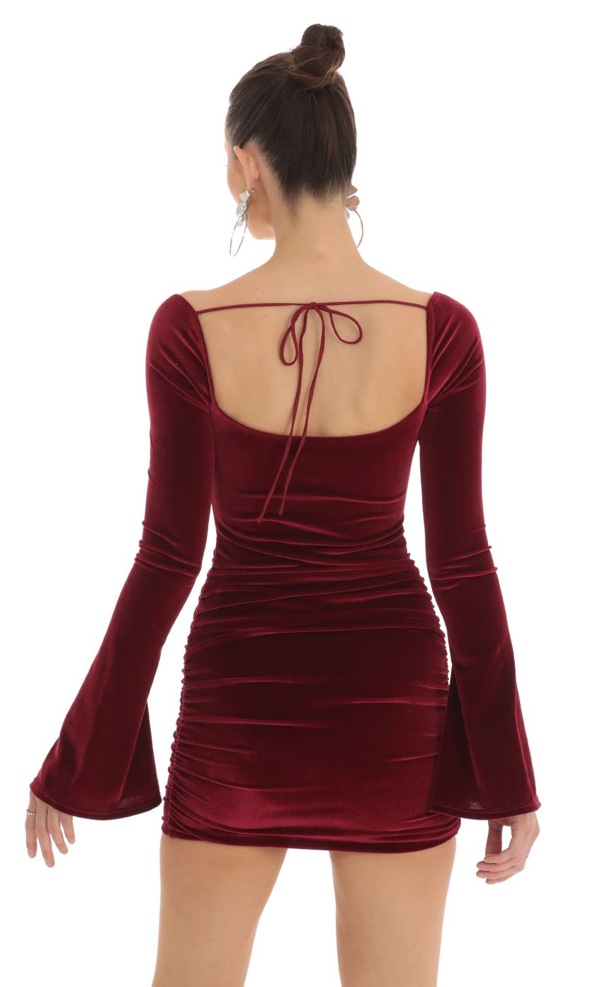 Picture Velvet Bell Sleeve Dress in Red. Source: https://media-img.lucyinthesky.com/data/Feb23/850xAUTO/9ebf2512-58e4-4d43-9034-48d019495367.jpg