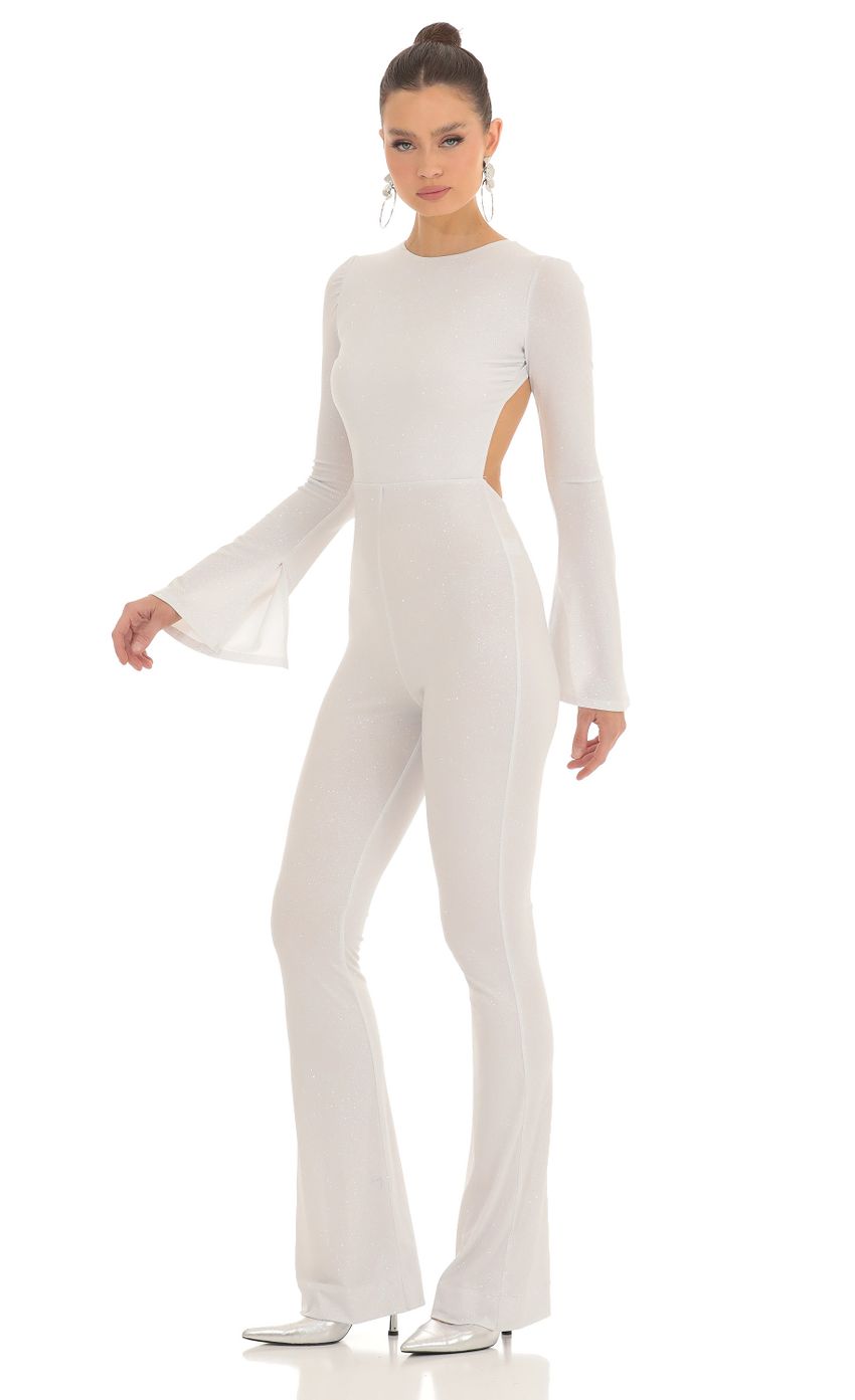 Picture Silver Shimmer Open Back Jumpsuit in White. Source: https://media-img.lucyinthesky.com/data/Feb23/850xAUTO/bbcbbc9b-037b-4f59-8150-7fb05e05601b.jpg