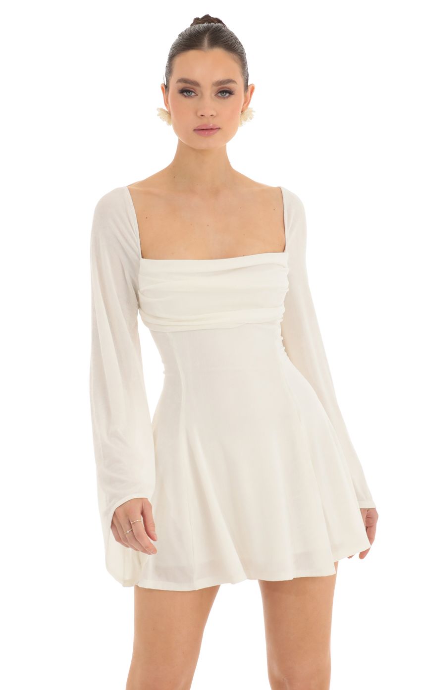 Picture Flare Sleeve Dress in Ivory. Source: https://media-img.lucyinthesky.com/data/Feb23/850xAUTO/c6209057-d604-40a4-94cf-c7f2b7c98a23.jpg