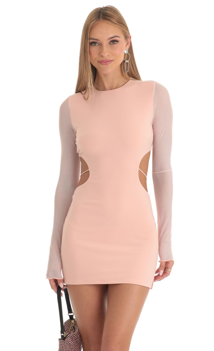 Picture Long Sleeve Open Back Dress in Peach. Source: https://media-img.lucyinthesky.com/data/Feb23/850xAUTO/c6ff598c-dafc-4c69-bf93-a890cb225b09.jpg